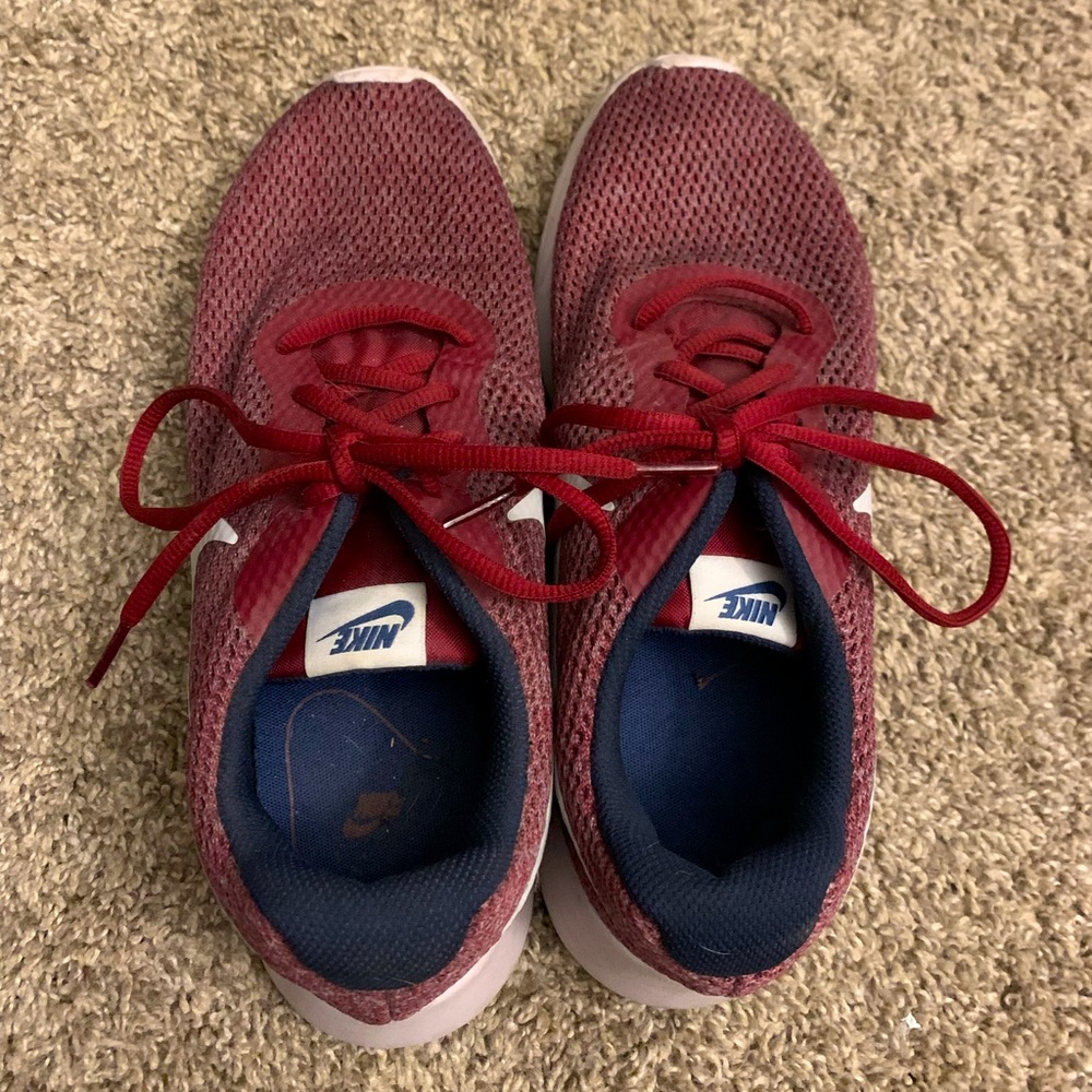 Maroon Nike athletic shoes